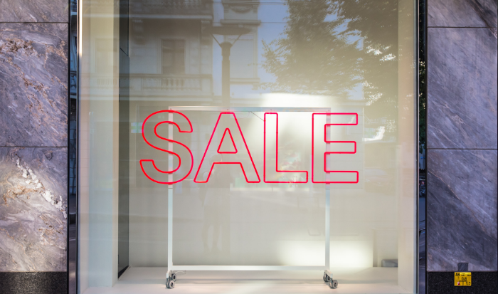A Neon Sale sign in a shop window