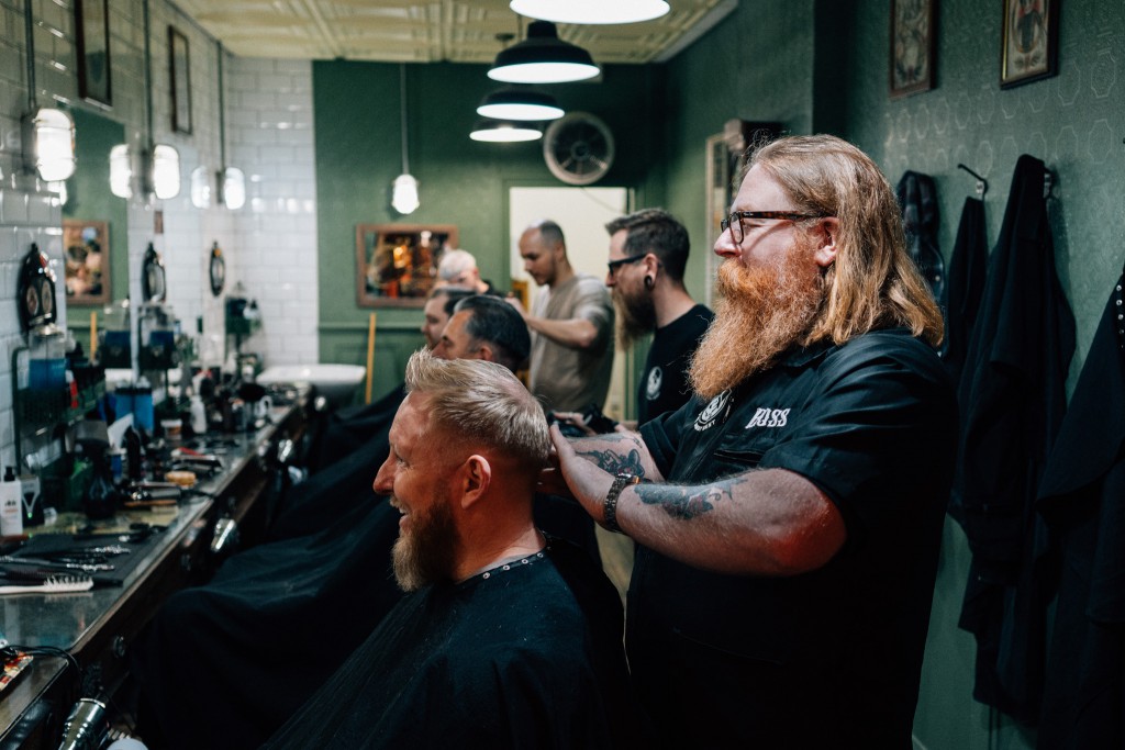 Shane O'Shaughnessy cuts hair in his barbershop in Derby
