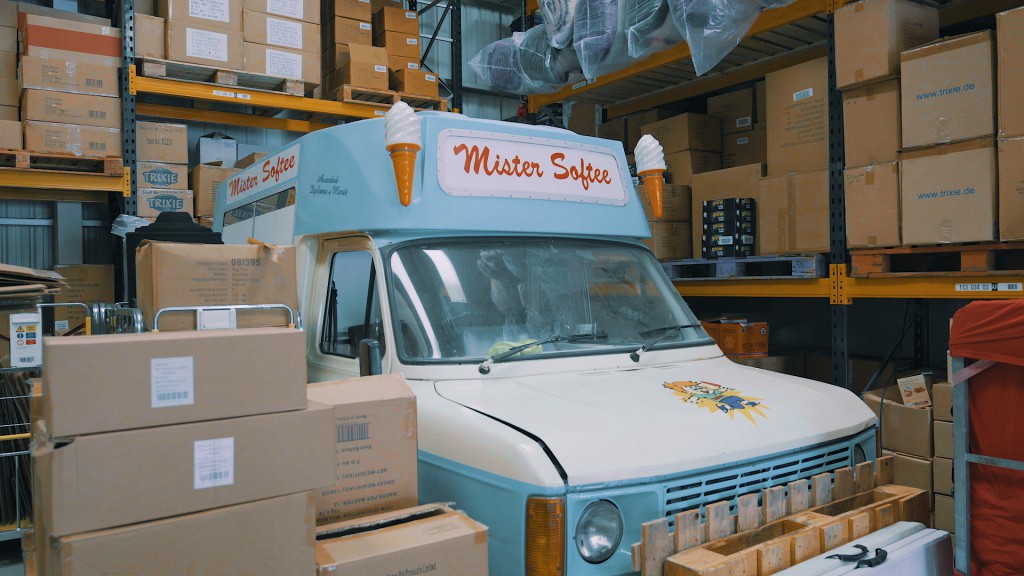 The Paws Trading Ice Cream Van sits amongst a pile of Paws Trading boxes in their warehouse