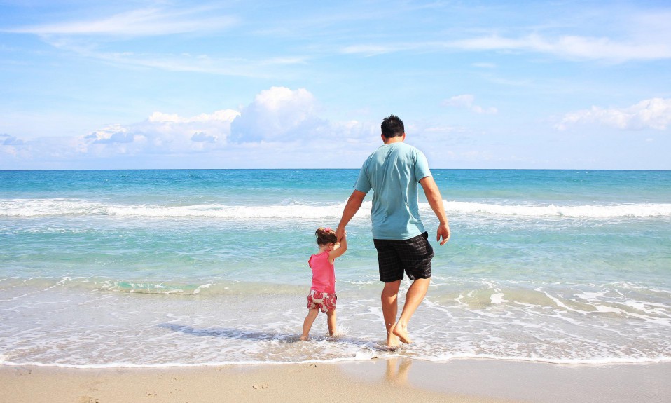 A father and his daughter on the beach