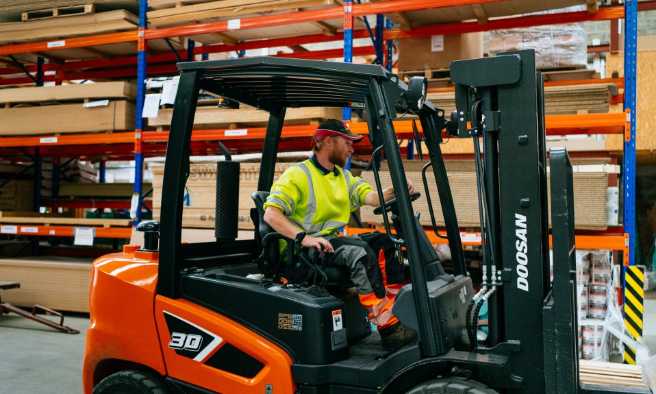 a worker drives a forklift through the warehouse at keith builders merchant in aberdeen