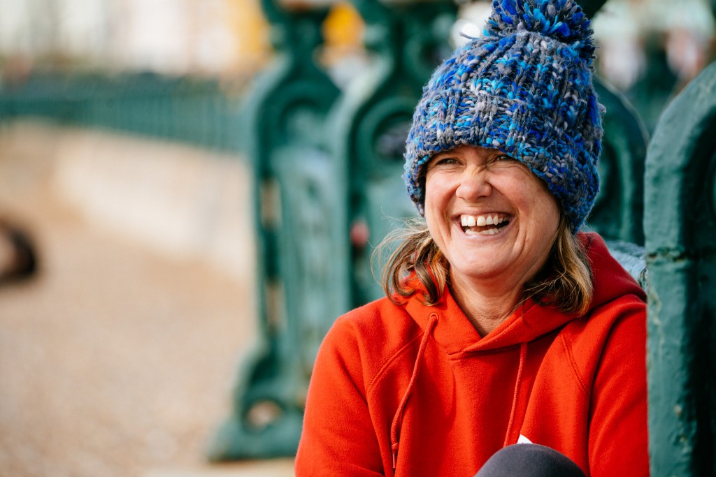 Kath of Seabirds LTD smiles next to the sea