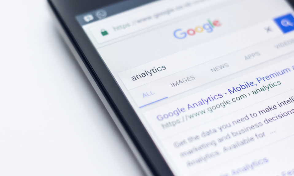 an iphone shows someone searching google for analytics