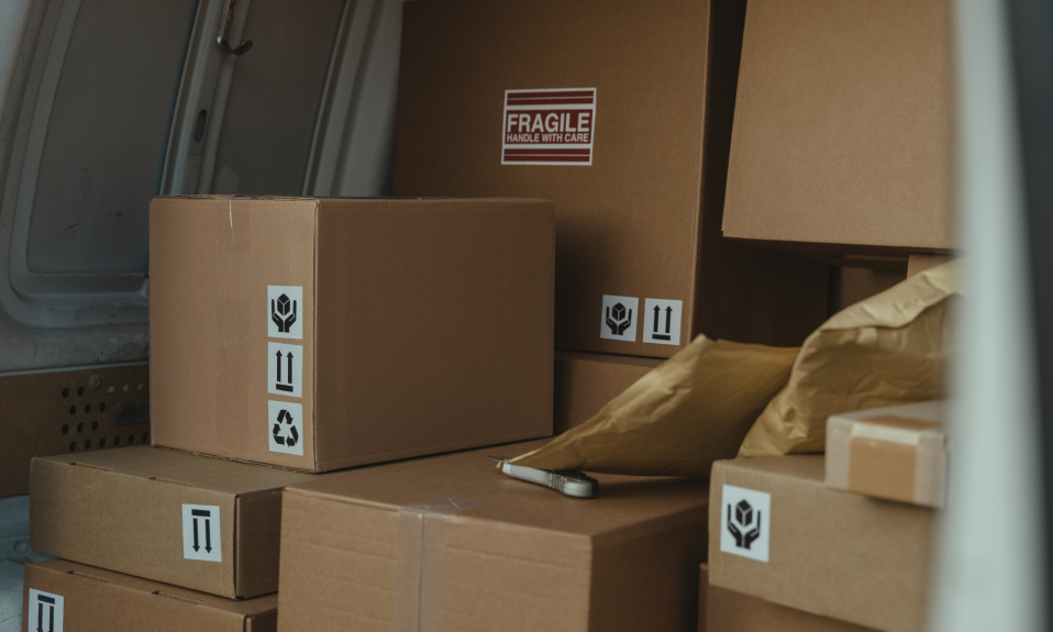a pile of parcels sit in a transit van