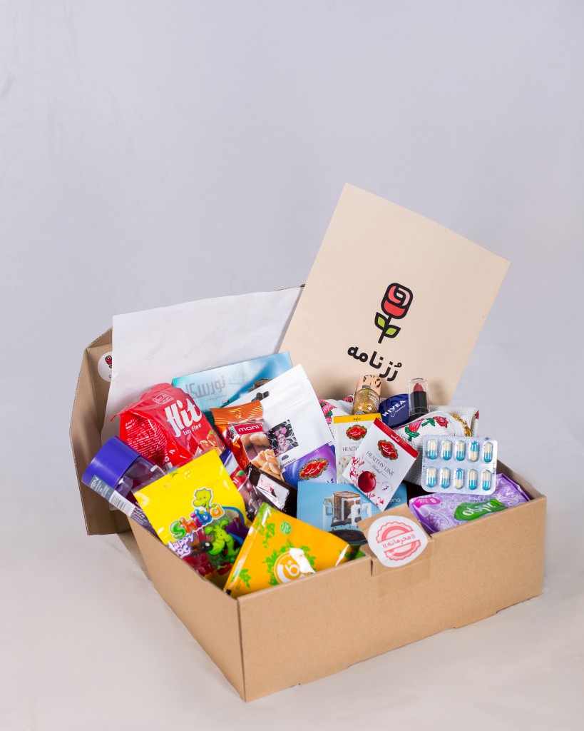 a cardboard box is open showing a variety of snacks from another country from a snack subscription box